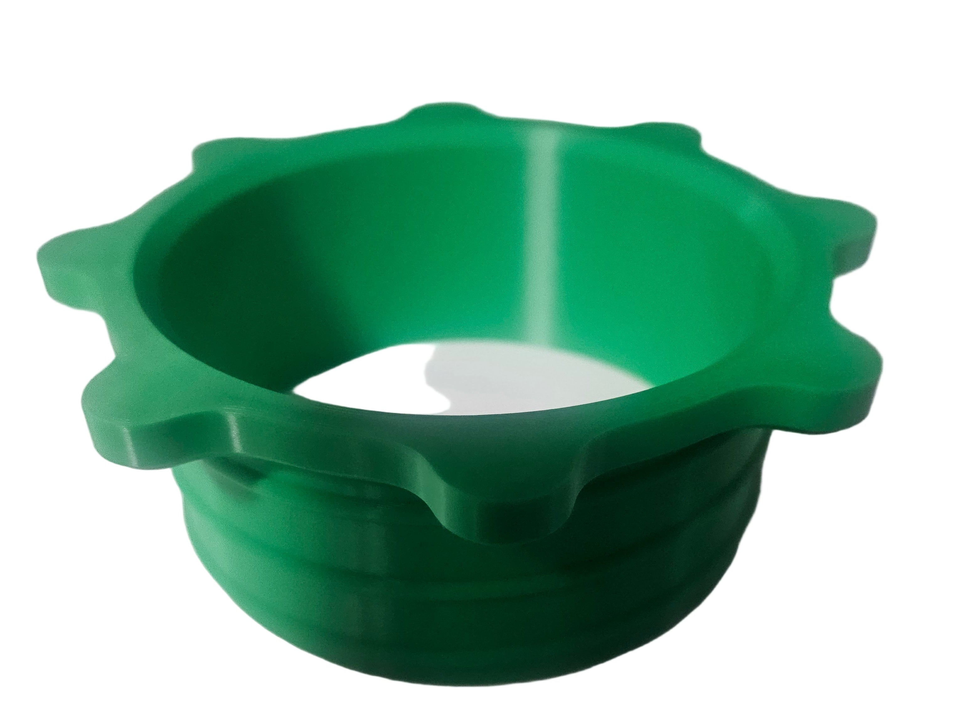 Green, plastic manufactured part with radial flange rings.